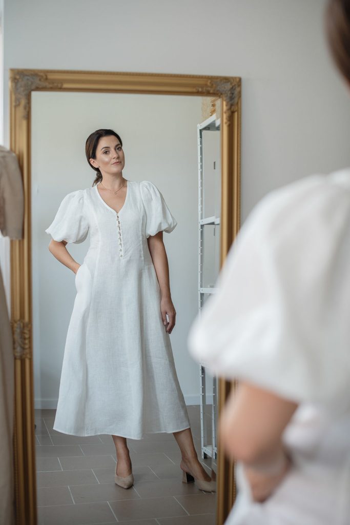 linen dress Marbella tyring on